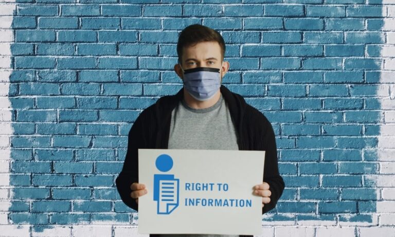 The guy is holding a poster with the inscription right to information