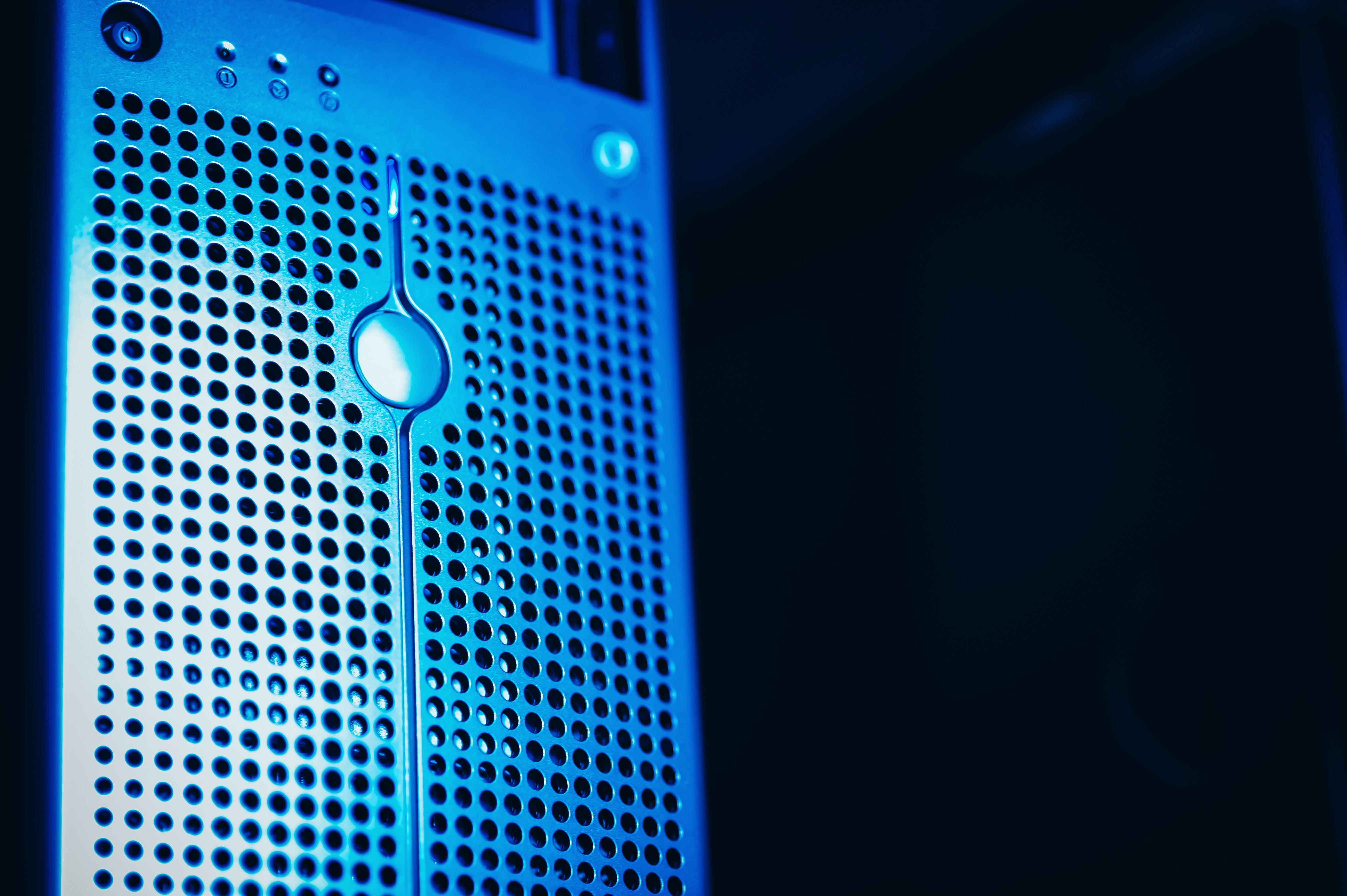 Blue-lit server racks in a secure data center, representing protected government information systems.
